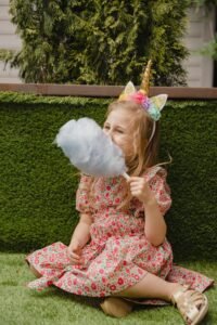 Child enjoying a stick of Candy Floss