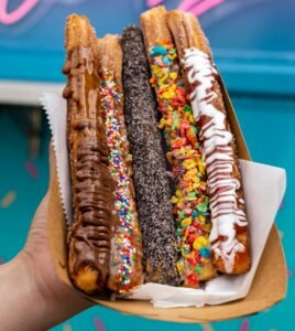 Churros with different toppings and sprinkles