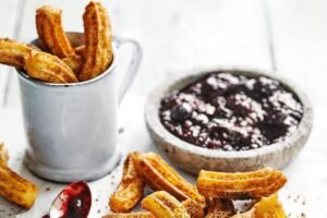 Churros with a berry compote