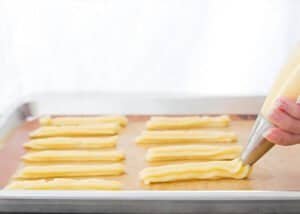 Dough being piped for making churros